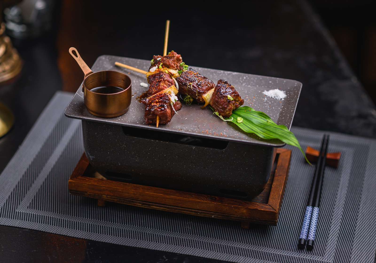 Wagyu Kushiyaki: grilled A4 Kagoshima Wagyu skewers served on a tabletop grill at Benny’s Phuket